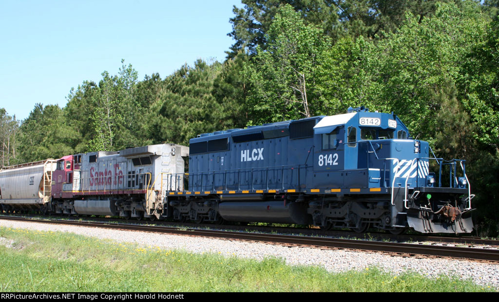 HLCX 8142 & BNSF 679 are tied down in the siding on a CSX train